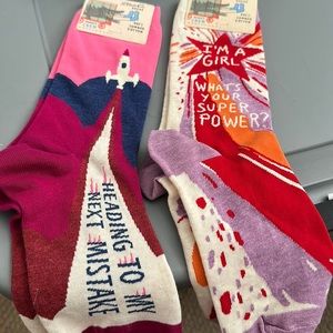 Brand new 2 pairs of blue q socks, women’s shoe size 5-10, with creative sayings